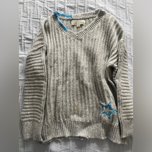 sweater with unique star embroidery on back and front with stitching on collar. - Picture 1 of 3